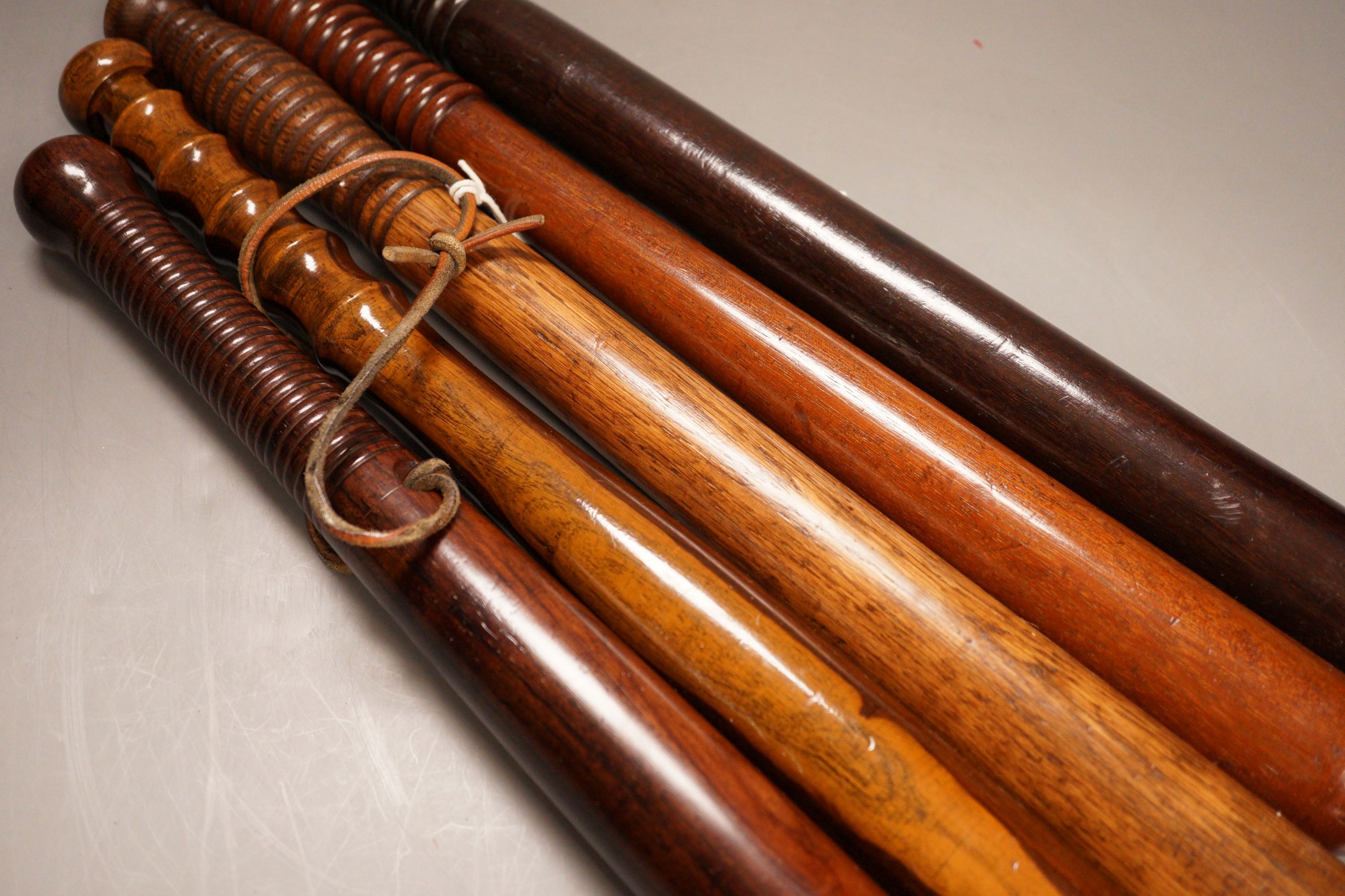 A collection of five assorted 19th century constabulary truncheons in varying woods